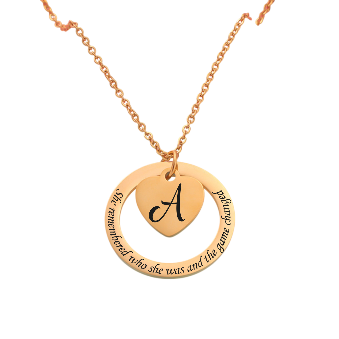 Gold necklace with a heart-shaped pendant featuring the letter 'A' and engraved text on a white background.