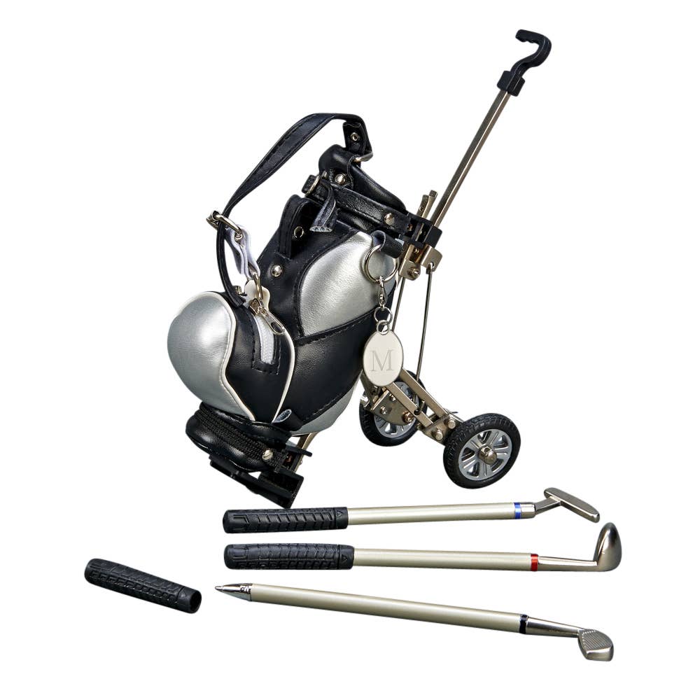 A golf bag with a silver and black color scheme, integrated with a small golf cart handle and wheels, alongside three golf pens.